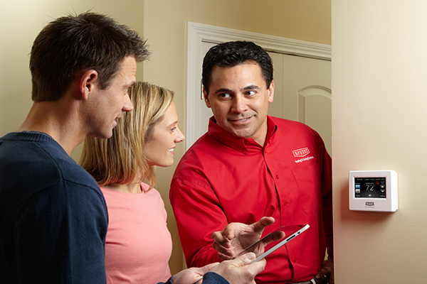Bryant Heating and Cooling Tech showing homeowner thermostat controls